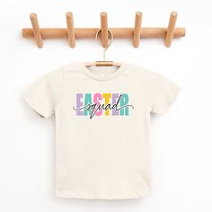 Looking for a cute tee for your kids? We have the perfect Easter Squad Colorful graphic tee addition to their closet! Also available in youth tees. Cute Multicolor T-shirt For Spring, Cotton T-shirt With Name Print For Spring, Cute Multicolor Graphic Print T-shirt, Playful Multicolor T-shirt For Spring, Cute Short Sleeve Easter T-shirt, Playful Cotton T-shirt For Spring, Spring Multicolor T-shirt With Text Print, Cute Multicolor T-shirt With Name Print, End Of School Year Multicolor T-shirt With Funny Print