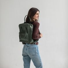 This leather city backpack is a perfect accessory for your everyday needs. Made from high-quality leather, it is durable and built to last. The backpack features multiple pockets and compartments to keep your belongings organized and easily accessible. The main compartment is spacious enough to fit a laptop, books, and other essentials. The adjustable straps provide comfortable carrying, while the top handle allows for easy grab-and-go convenience. The backpack is designed with a timeless style that will complement any outfit, making it suitable for both work and casual use. Upgrade your wardrobe with this stylish and functional leather backpack! Dimensions: Height - 13 inch / 33 cm  Width - 10.43 inch / 26.5 cm  Depth - 4.13 inch / 10.5 cm Green Leather Backpack For On-the-go, Leather Everyday Backpack, Classic Green Backpack For Everyday, Modern Backpack With Leather Lining For Everyday, Leather Backpack For Commuting, Modern Leather Backpack With Leather Lining For Everyday, Green Soft Leather Backpack For Everyday, Leather Standard Backpack For Commuting, Green Leather Travel Backpack