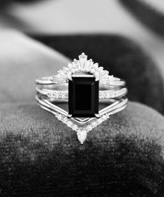 a black and white photo of an engagement ring