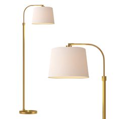 two floor lamps with white shades on them