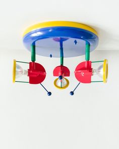 a toy airplane is hanging from the ceiling