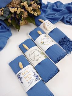 four blue napkins are sitting on a table