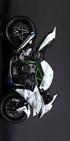 an aerial view of a motorcycle on a black background