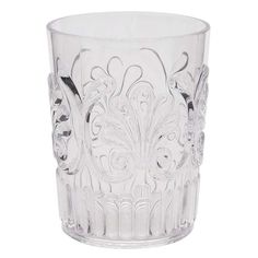 a clear glass with an intricate design on the rim and bottom, sitting in front of a white background