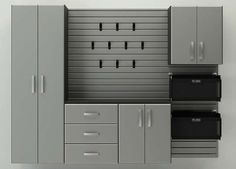 an image of a garage storage unit with drawers and cabinets on the wall in front of it