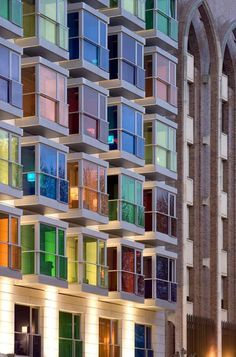 a multicolored building with many windows on it