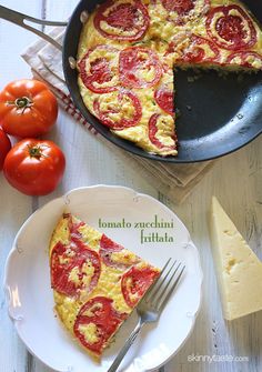 a slice of tomato pizza on a plate with a fork and knife next to it