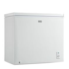 a white chest freezer sitting on top of a white floor next to a wall