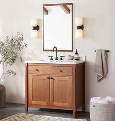 a bathroom with a sink, mirror and rug