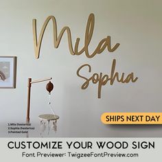 a white wall with gold lettering that says, customize your wood sign for free