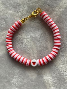 red and white striped bracelet with heart charm