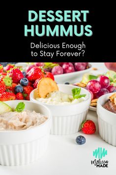 dessert hummus with berries, kiwis and other fruit in white bowls on a table