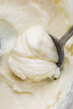 a scoop of ice cream in a bowl with a spoon