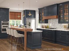 a kitchen with dark blue cabinets and white counter tops