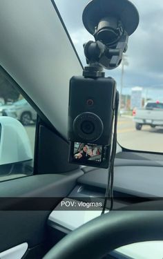 a dash camera mounted on the dashboard of a car