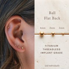 the back of a woman's ear with two gold balls attached to it, next to an image of a pair of earrings