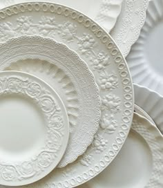 white plates stacked on top of each other