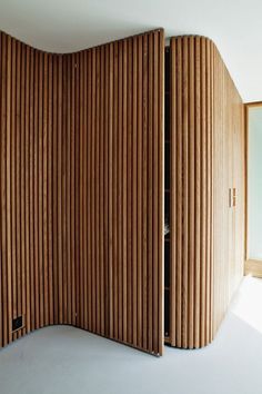 a room divider made out of wooden slats