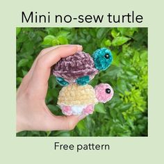 a hand holding a small stuffed turtle in it's right hand with the words mini no - sew turtle free pattern