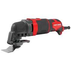 a red and black cordless tool on a white background with clipping for attachments