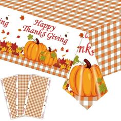 a thanksgiving table cloth with pumpkins on it