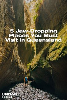 a person walking through a narrow canyon with text overlay reading 5 jaw - dropping places you must visit in queensland