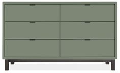 a green dresser with four drawers