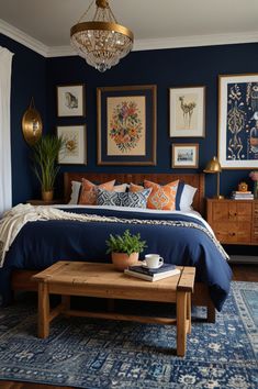 a bedroom with blue walls and pictures on the wall