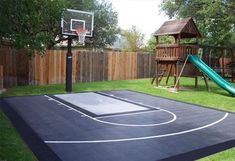 a backyard basketball court with a green slide