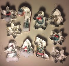 a group of christmas ornaments hanging on a wall