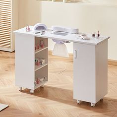 a white desk sitting on top of a hard wood floor