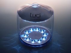 a round light in a clear case with blue lights on the inside and around it