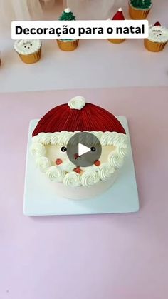 there is a cake that has been decorated with santa claus's hat on it