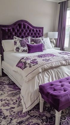 a bedroom with purple and white decor