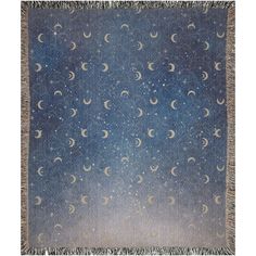 a blue and white blanket with stars and crescents in the night sky on it