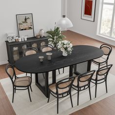 a dining room table with chairs around it