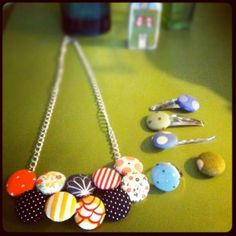 a necklace with several different types of buttons on it