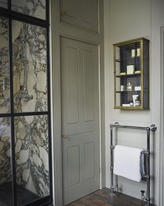 a bathroom with marble walls and flooring