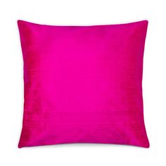 a bright pink pillow on a white background