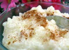 a bowl filled with mashed potatoes topped with cinnamon