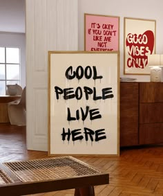 there is a sign that says cool people live here on the wall next to it