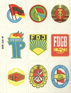 several different colored stickers on a white sheet with the words fdjg