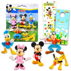 the mickey mouse figurines are on display in front of their packaging and package