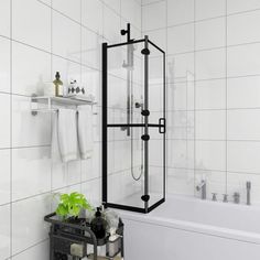 a bathroom with white tile and black accents