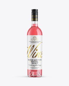 a bottle of wine that is pink and white with gold lettering on the label, in front of a plain background