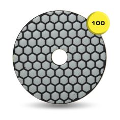 a white diamond polishing disc with the number 100 on it and yellow dot in the middle