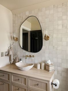 a bathroom with a sink and mirror on the wall