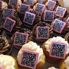 cupcakes with qr - code on them are displayed