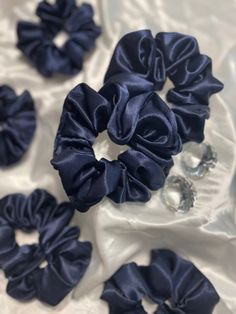 Introducing our Navy Blue Silky Scrunchie: the perfect accessory to add a touch of elegance and style to your hair. Made from premium quality silky fabric, this scrunchie is soft, smooth, and gentle on your hair, preventing any breakage or damage. The deep navy blue color adds a sophisticated and timeless look to any hairstyle. Whether you're wearing it for a casual day out or a special occasion, this scrunchie will effortlessly elevate your hair game. Designed to provide a comfortable fit, this Blue Accessories Aesthetic, Veronica Core, Navy Blue Accessories, Blue Scrunchie, Blue Core, Navy Accessories, Wrist Accessories, Hair Accessories Collection, Deep Navy Blue