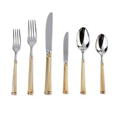 five pieces of silverware with gold trimmings on each fork and two knives